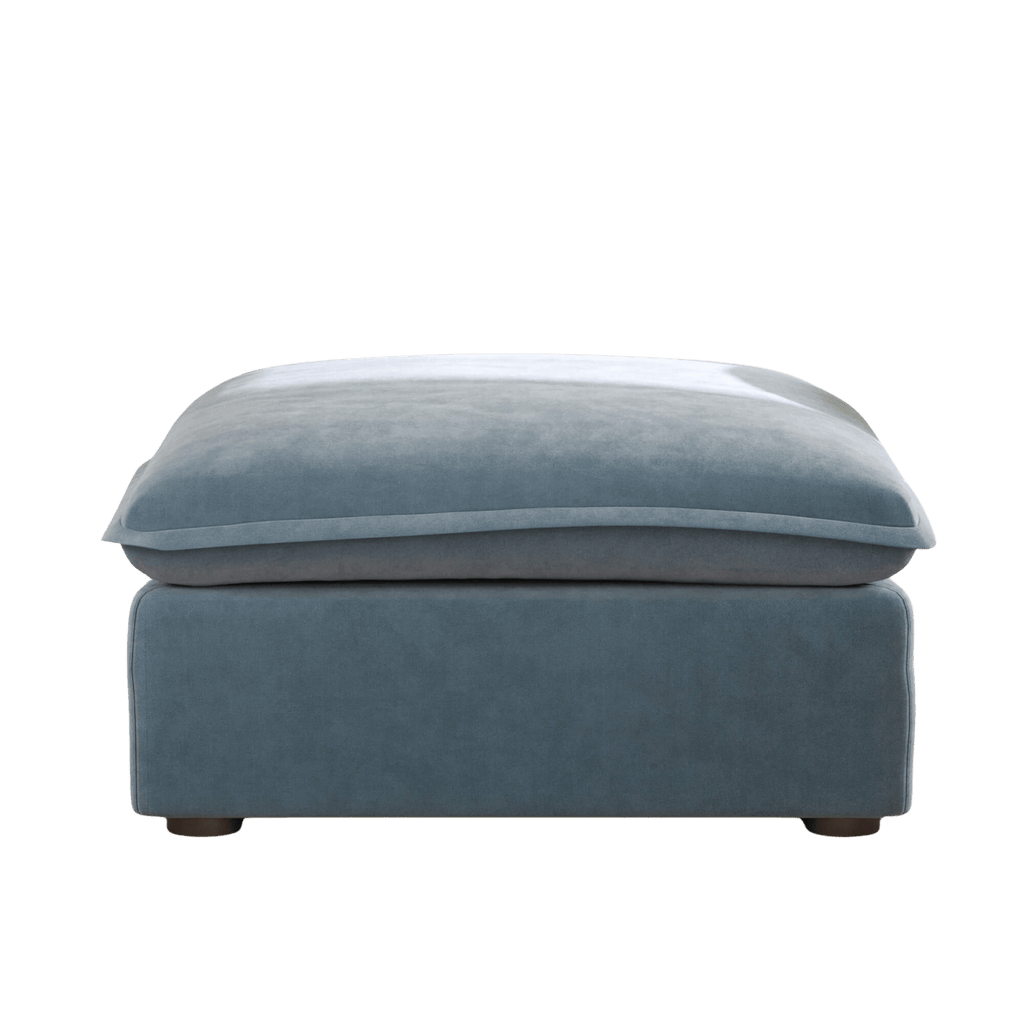 Baby blue ottoman with washable velvet covers, no background image.