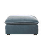 Baby blue ottoman with washable velvet covers, no background image.
