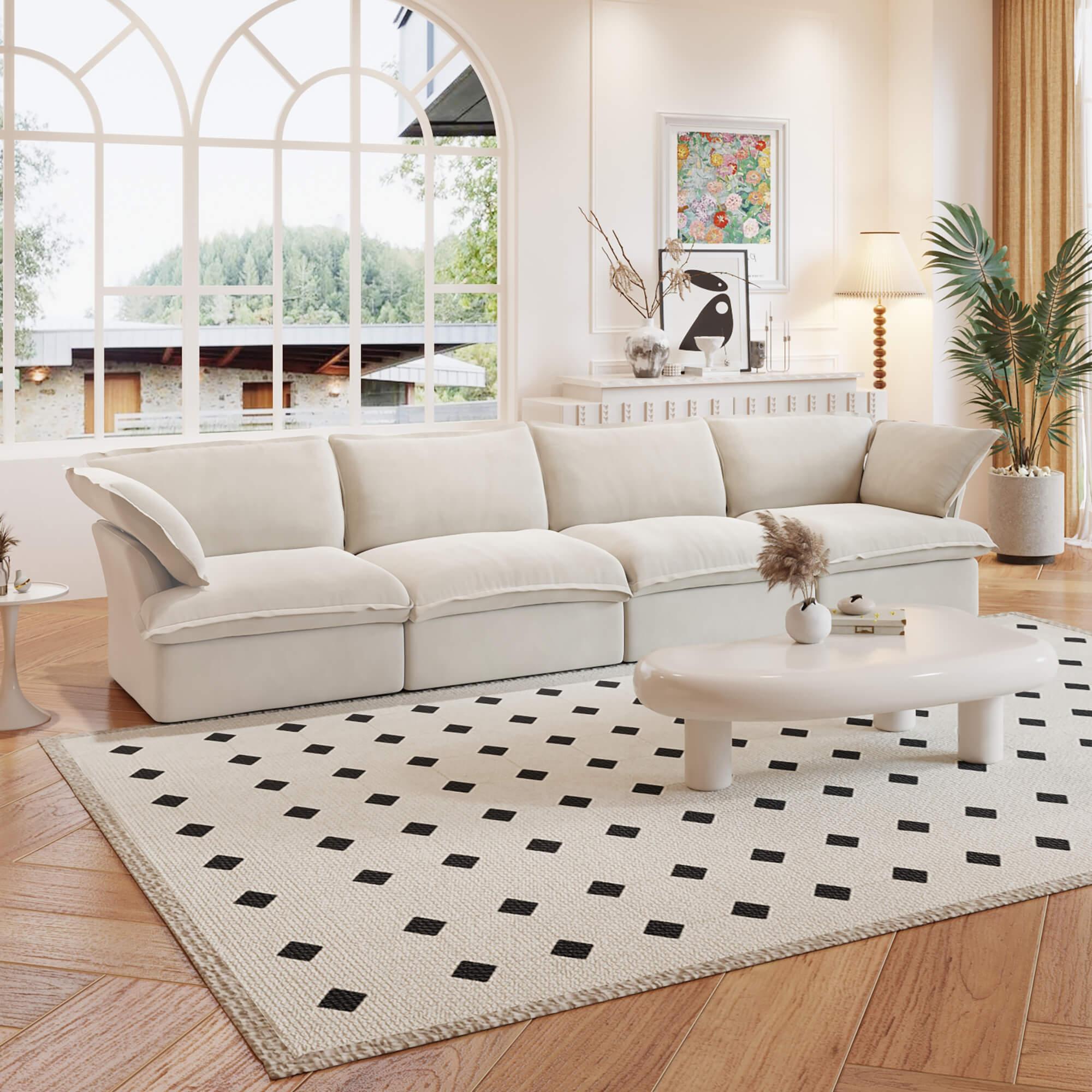 A beige linen sectional 4-seat sofa arranged in a living room setting with deep seating.