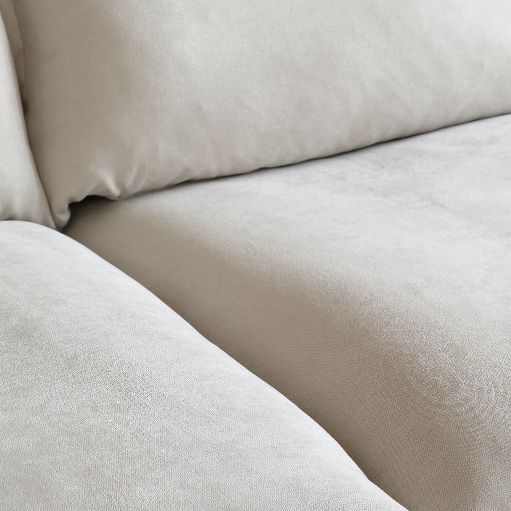 Close-up of a beige linen fabric of a sofa