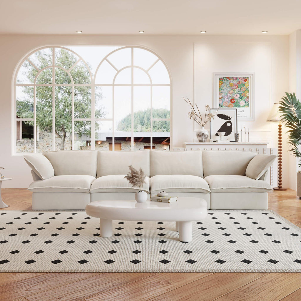 A beige linen 4-seat sectional sofa arranged in a living room setting with deep seating.