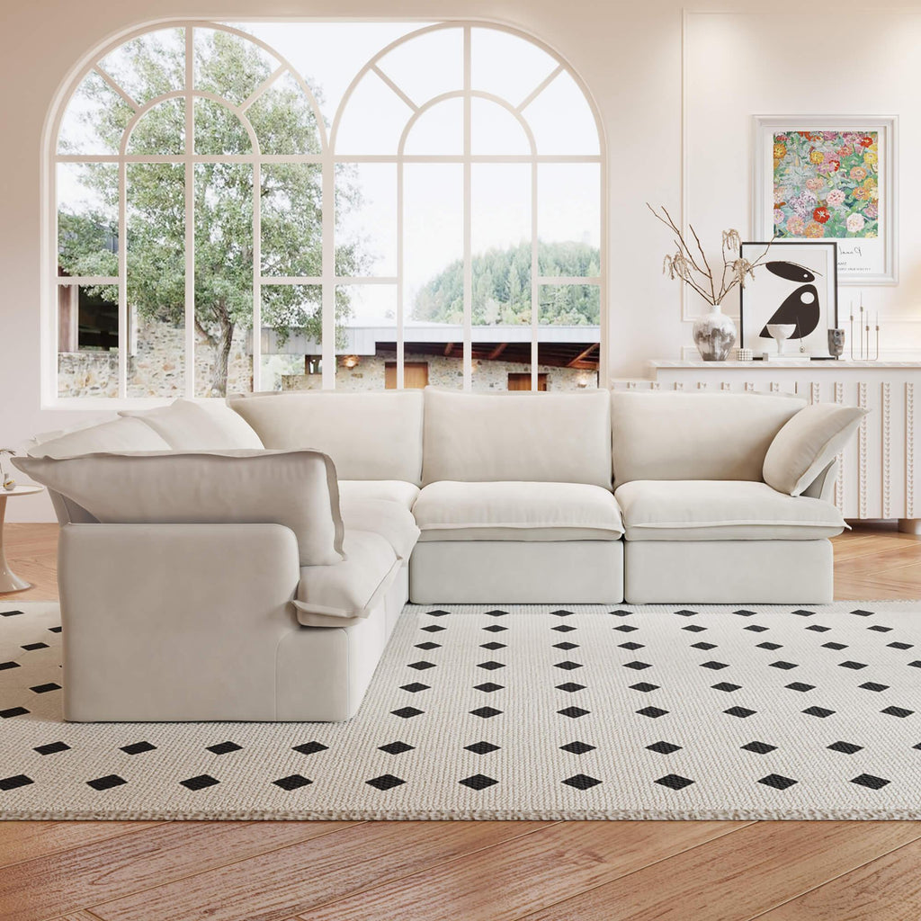A beige 5-piece corner linen sectional sofa arranged in a living room setting with a patterned rug on the floor.