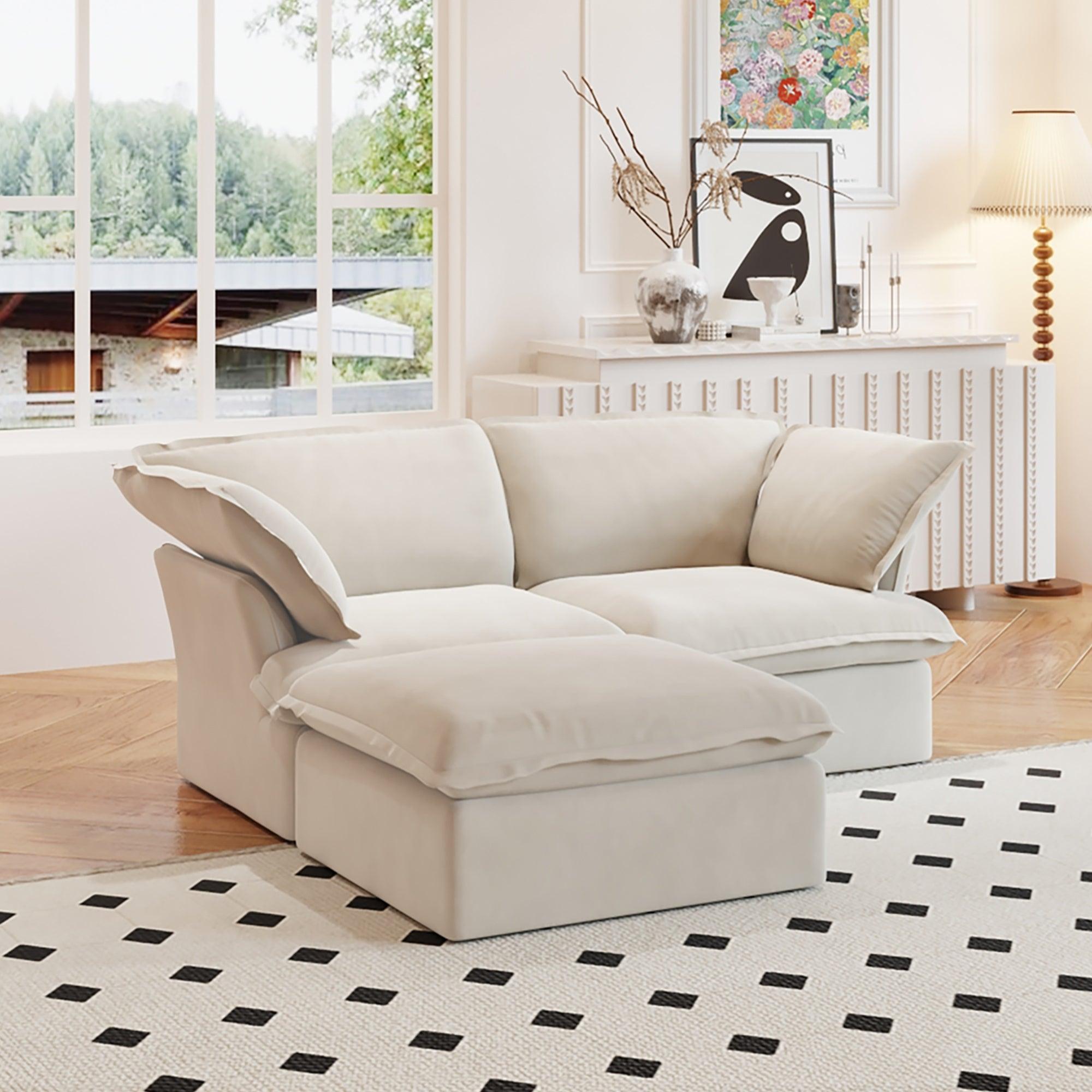 A beige chaise lounge loveseat linen sectional sofa with a modular design and a storage ottoman, placed on a patterned rug in a bright living space.
