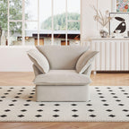 A beige linen armchair with a solid frame and washable covers, placed on a patterned rug in a bright room.