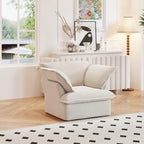 A beige linen armchair with a solid frame and washable covers, placed on a patterned rug in a bright room.