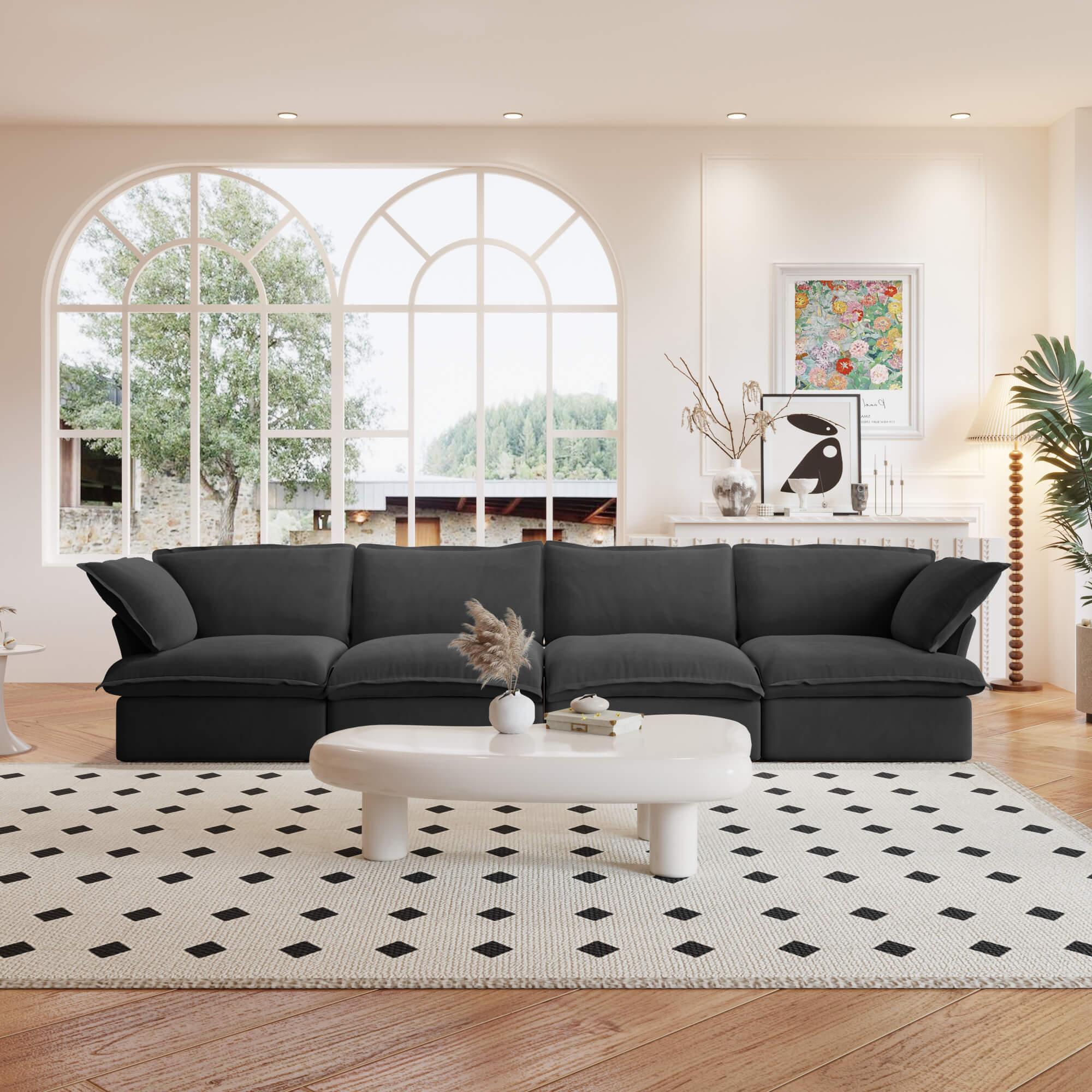 A black linen 4-seat sectional sofa arranged in a living room setting with deep seating.