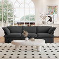 A black 3-seater linen sectional sofa in a modern living room setting with deep seating.