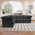 A black 5-piece corner linen sectional sofa arranged in a living room setting with a patterned rug on the floor.