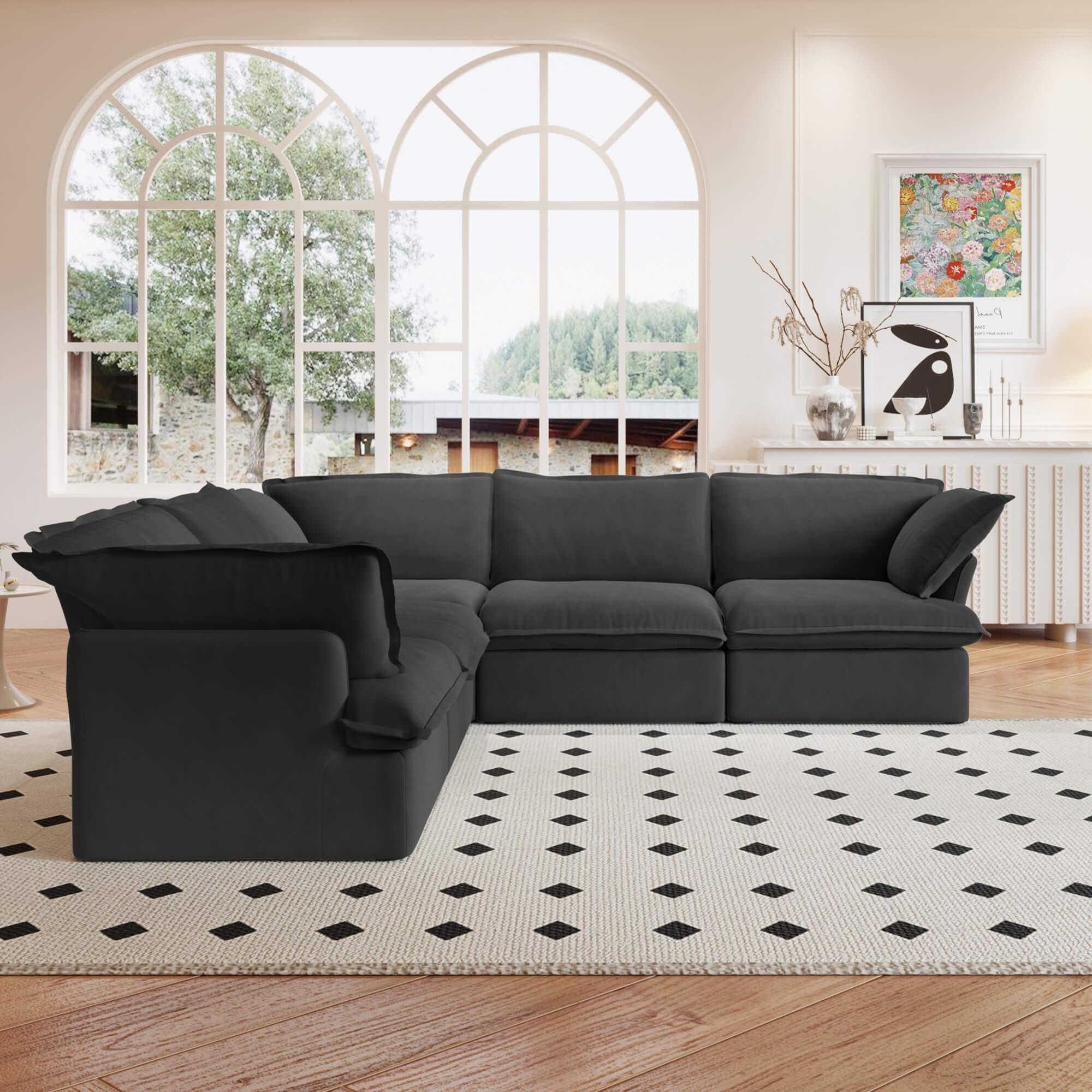 A black 5-piece corner linen sectional sofa arranged in a living room setting with a patterned rug on the floor.