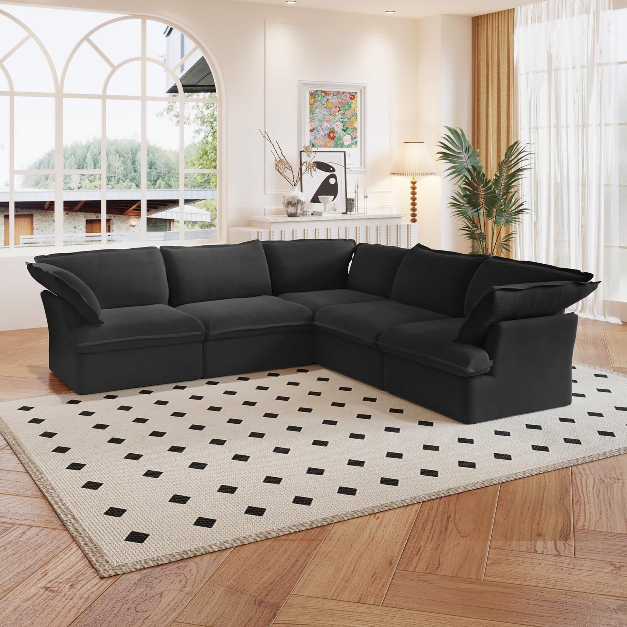A black 5-piece corner linen sectional sofa arranged in a living room setting with a patterned rug on the floor.
