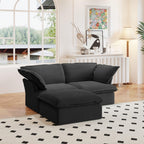 A black chaise lounge loveseat linen sectional sofa with a modular design and a storage ottoman, placed on a patterned rug in a bright living space.