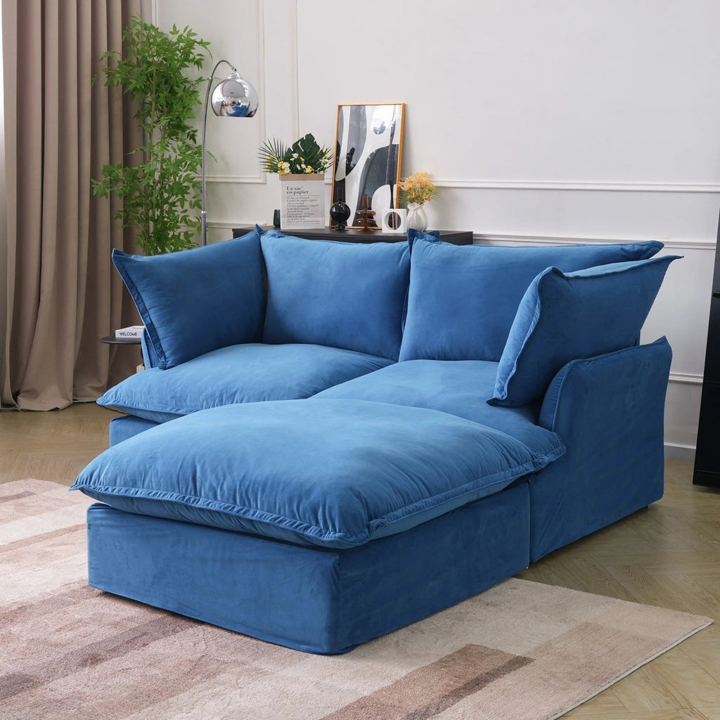 Blue velvet 2-seater sectional with washable covers, side view.