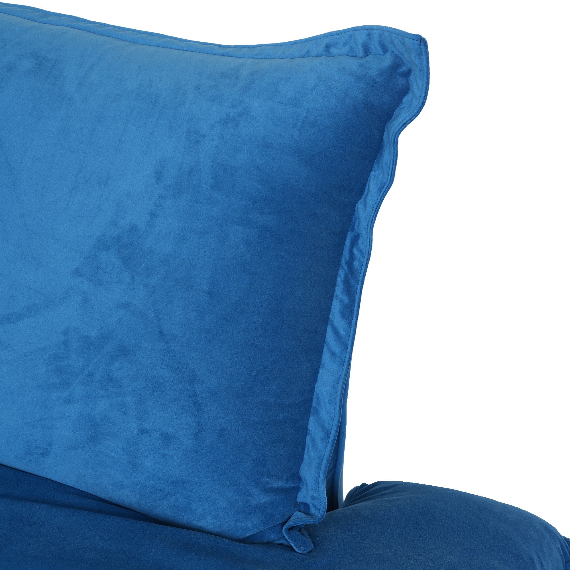 Close-up of the pillow of a blue velvet sofa