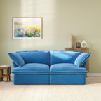 Modular blue velvet loveseat sofa with curved armrests, front