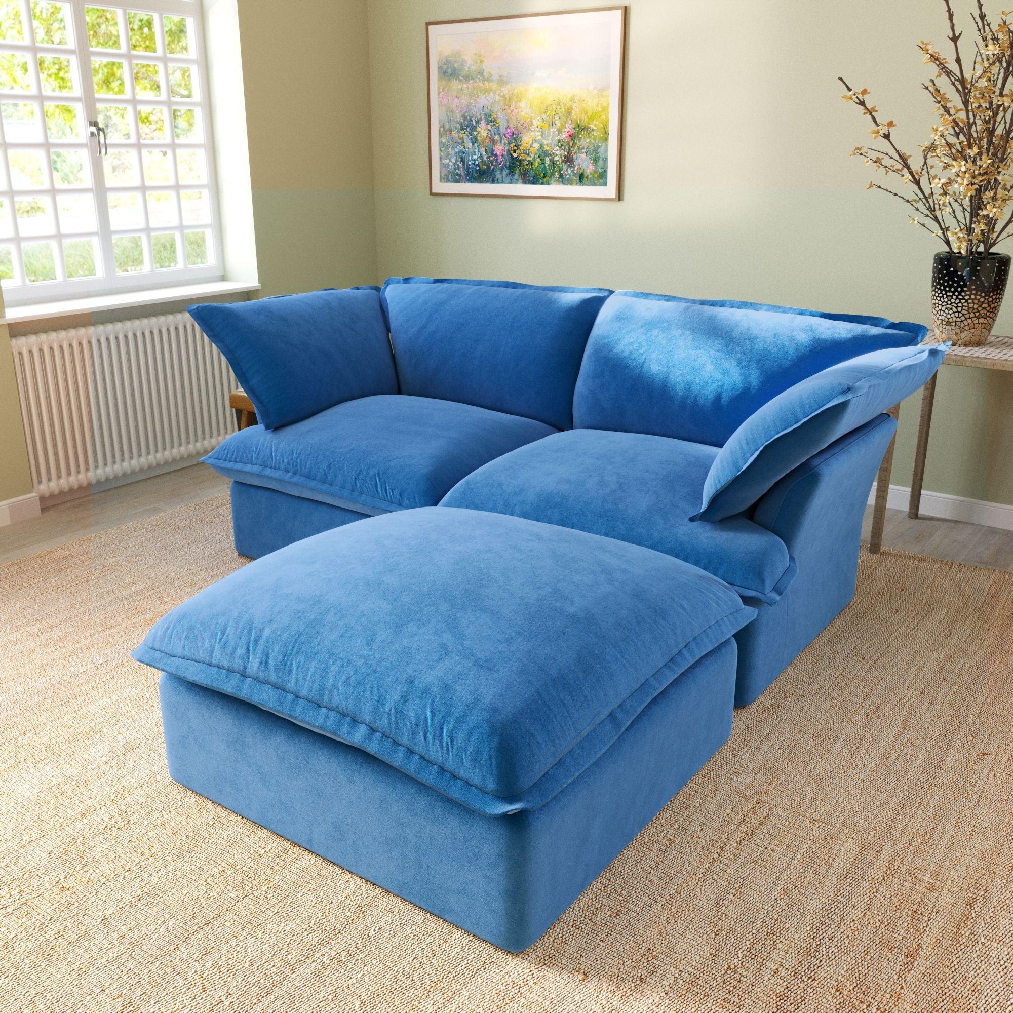 Modular velvet loveseat sofa with storage ottoman and curved armrests in blue, side