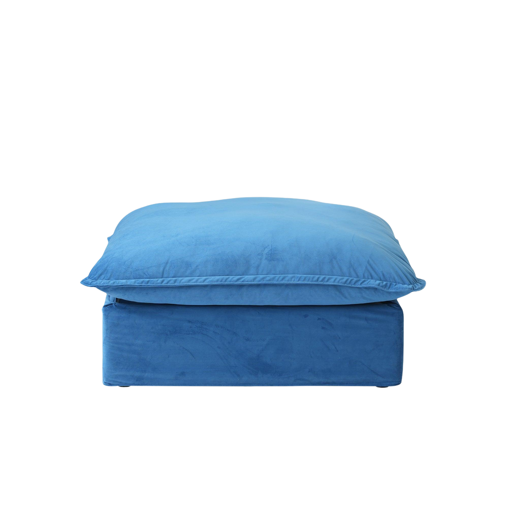 Blue ottoman with a matching cushion on a white background