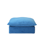 Blue ottoman with a matching cushion on a white background