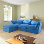 An L-shaped velvet sectional sofa in green color, with a replaceable cover, arranged in a living room setting.