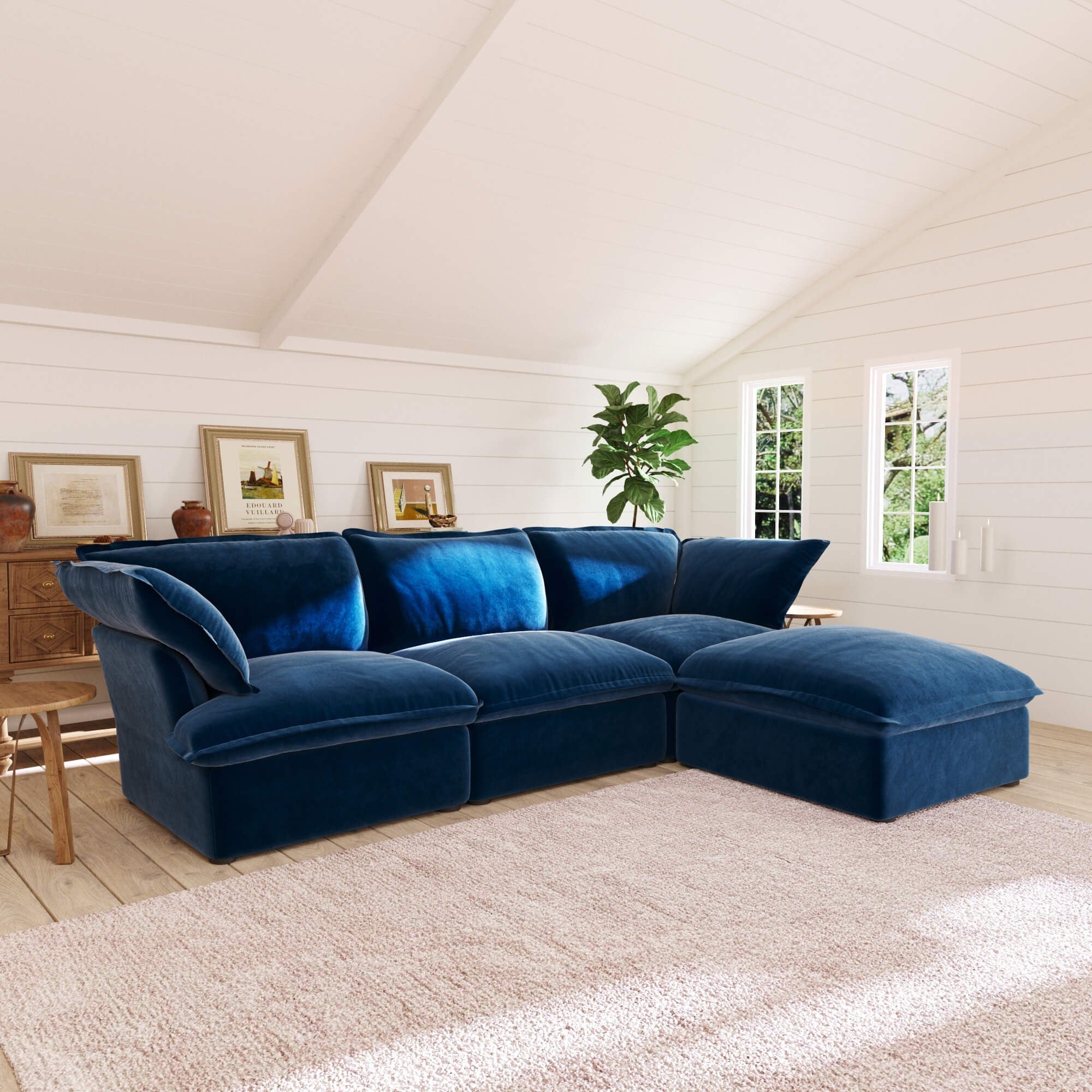 Dark blue L-shaped 4 -seater sectional sofa in a living room with white walls and wooden floor.