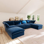 Dark blue U-shaped sectional sofa in a living room with wooden floor and white walls