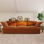 Dark orange 3-seat sectional sofa in a living room with decorative elements.