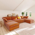 Dark orange U-shaped sectional sofa in a room with wooden floor and white walls