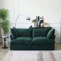 Green velvet 2-seat sofa with flared arms and washable covers.