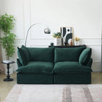 Green velvet 2-seat sofa with flared arms and washable covers.