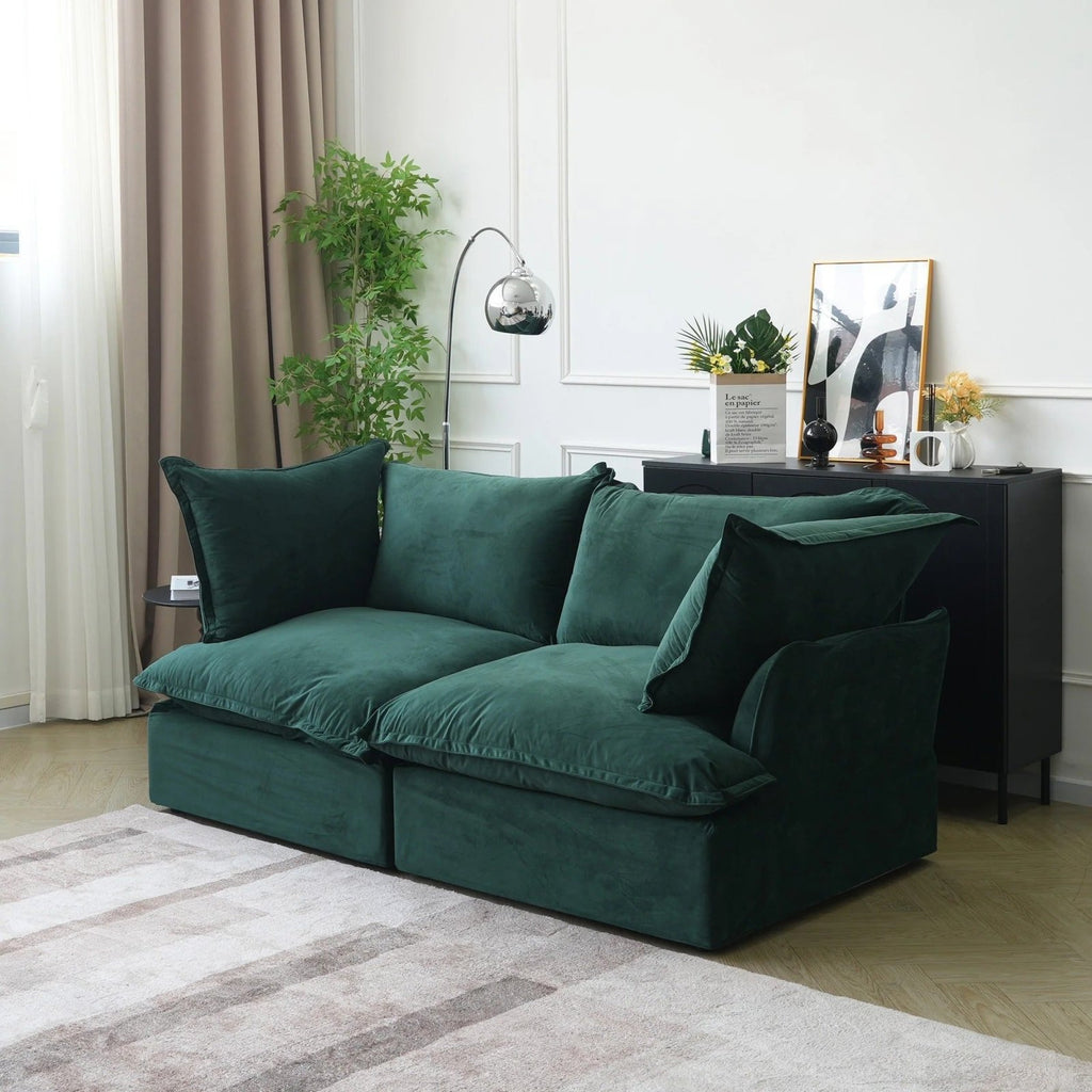 Velvet washable loveseat with flared arms in green.