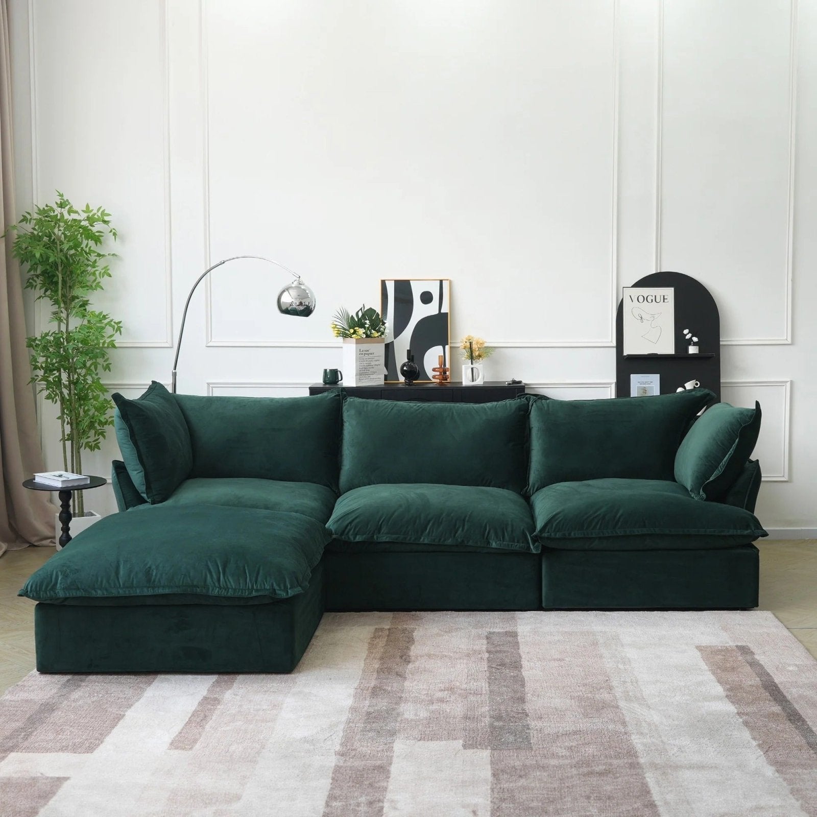 Green velvet 3-seater L-shaped sectional with washable covers and storage ottoman.