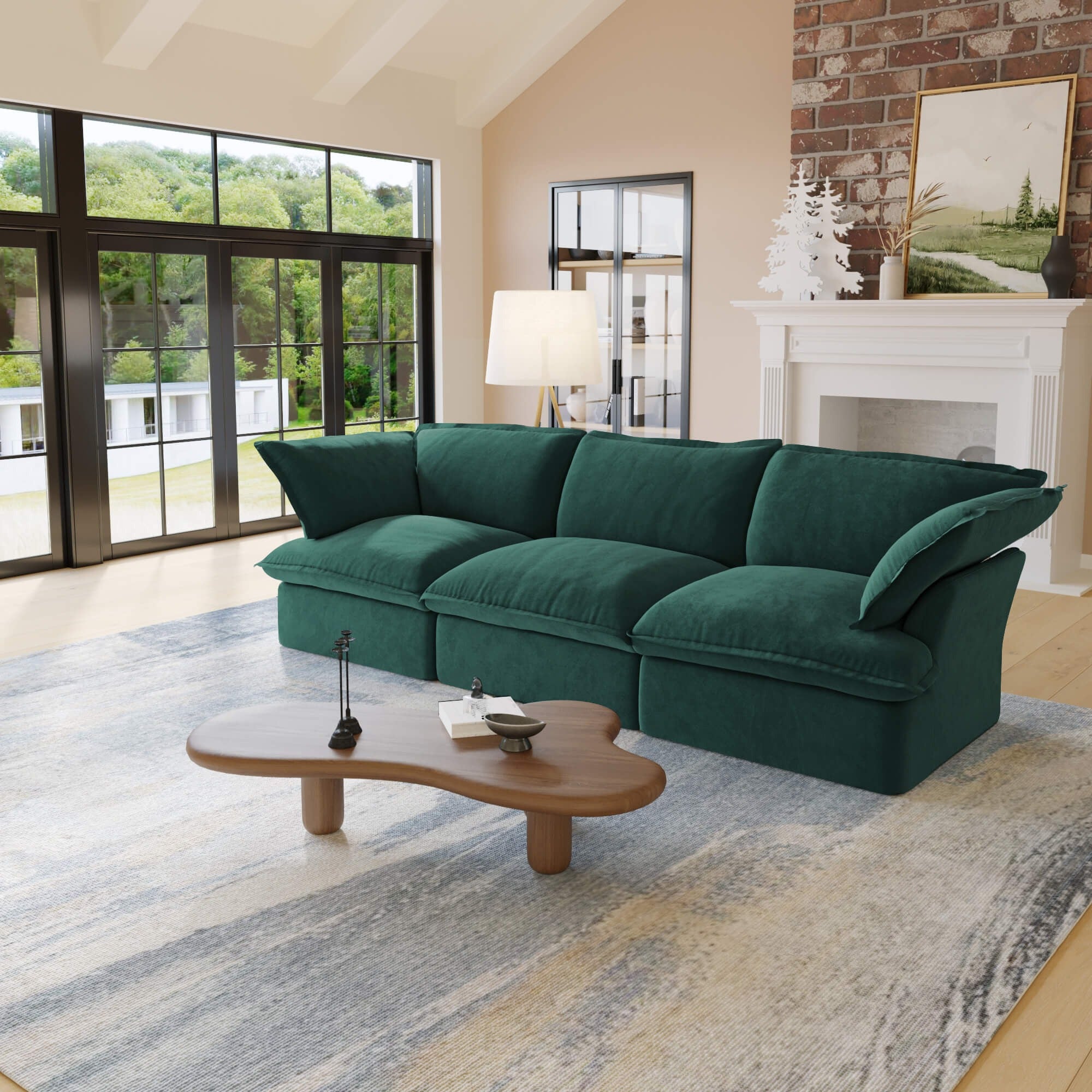 Green 3-seater sofa in a living room with a coffee table and large windows.