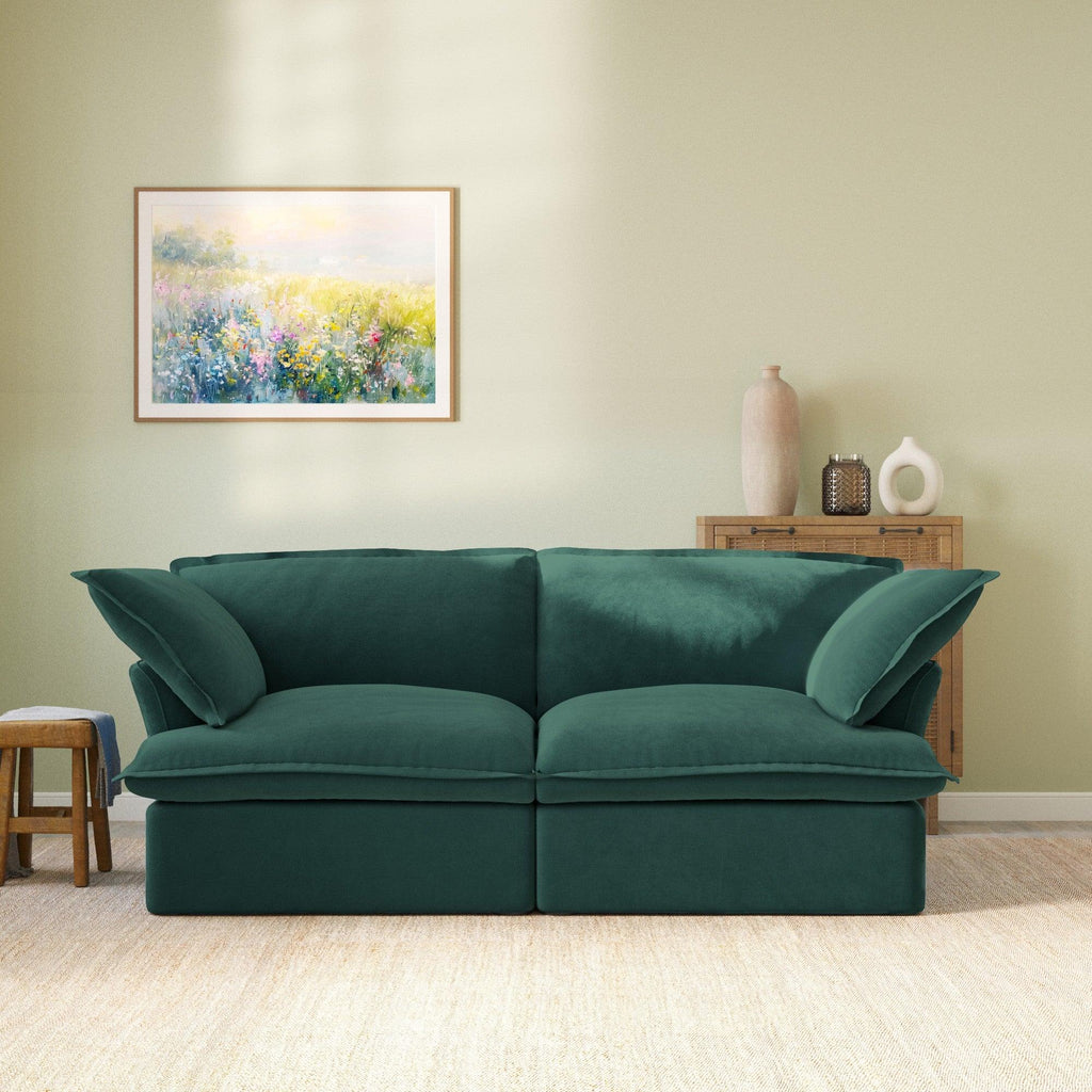 Modular velvet sofa with curved armrests in green, front