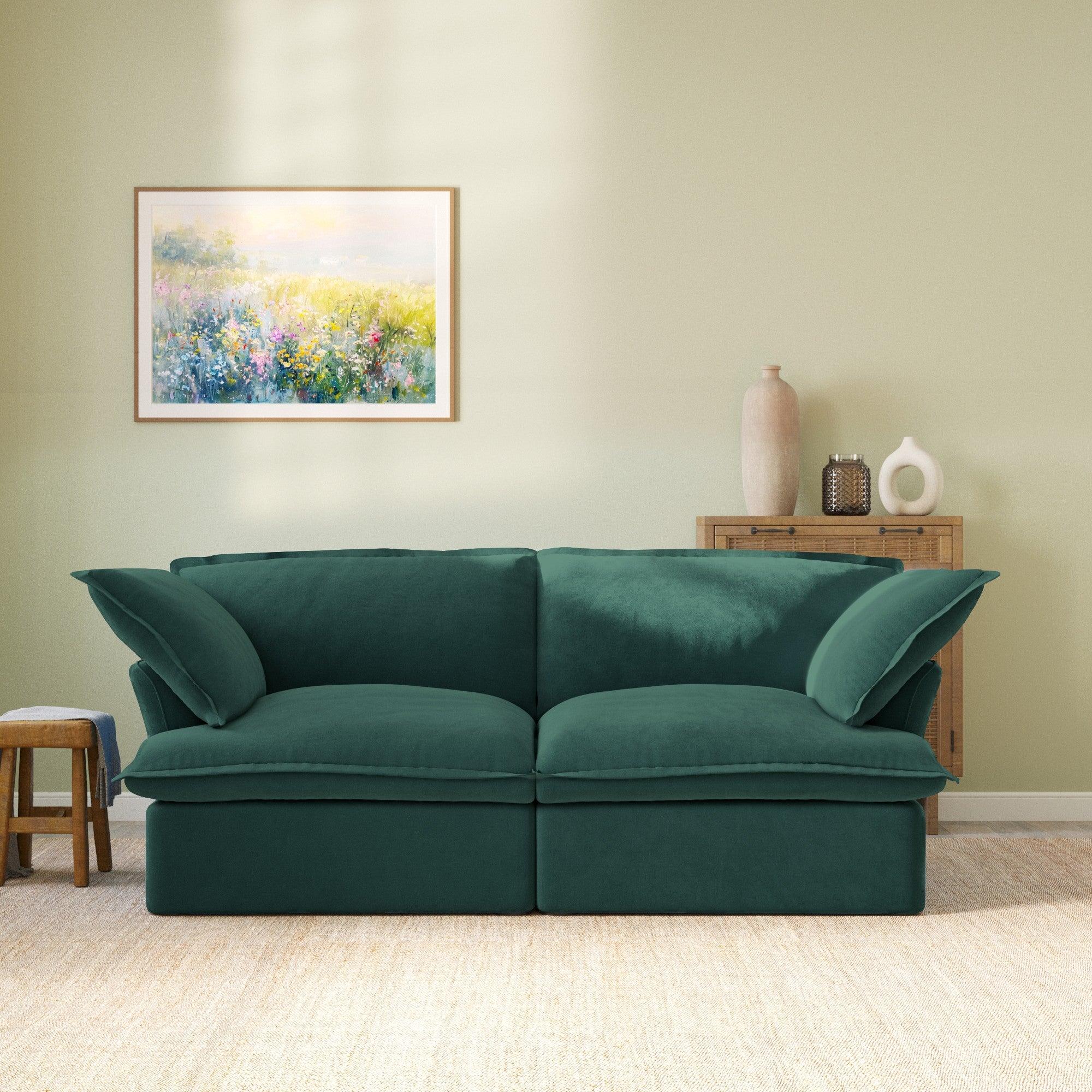 Modular velvet sofa with curved armrests in green, front