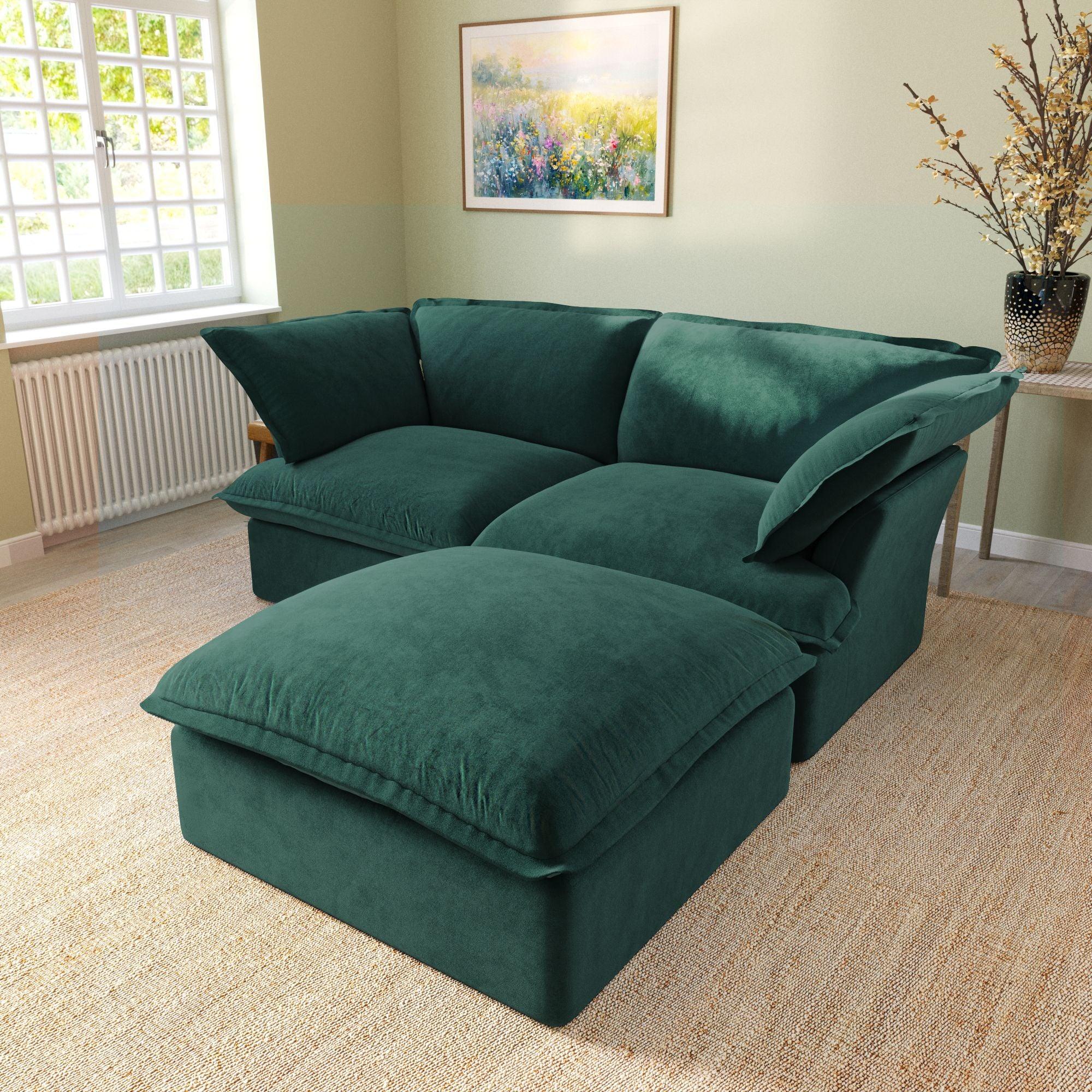 Modular velvet loveseat sofa with storage ottoman and curved armrests in green, side