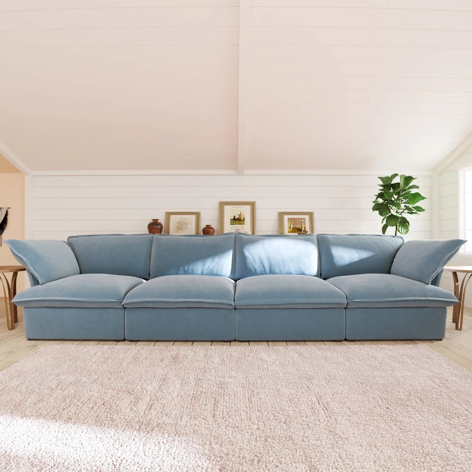 Light blue 4-seat sofa in a living room setting with a neutral color palette