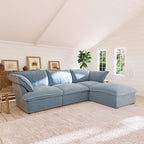 Light blue L-shaped 4-seater sectional sofa in a living room with white walls and wooden floors.