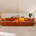 Orange sectional 4-seat sofa in a living room with a neutral color palette