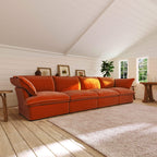Orange 4-seat sectional sofa in a room with wooden floor and white walls