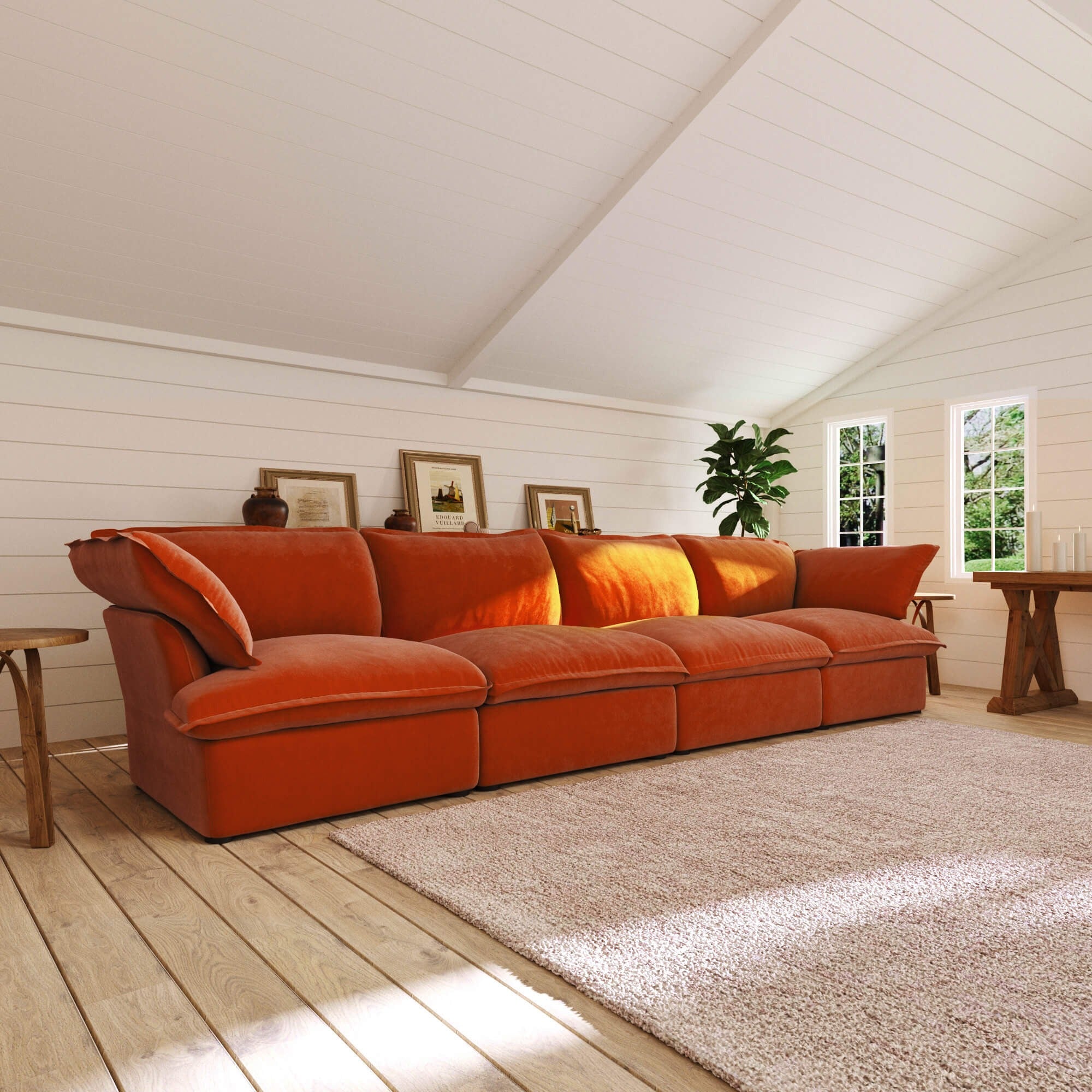 Orange 4-seat sectional sofa in a room with wooden floor and white walls
