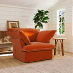Orange armchair in a room with a plant and window