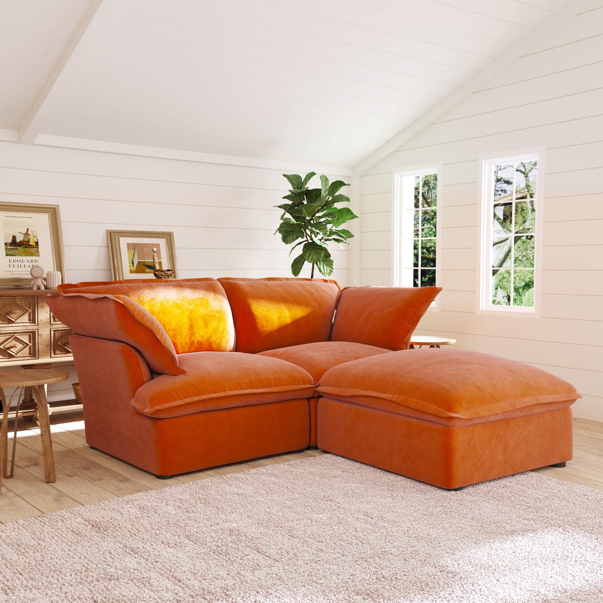 Orange sectional sofa in a room with wooden floor and white walls