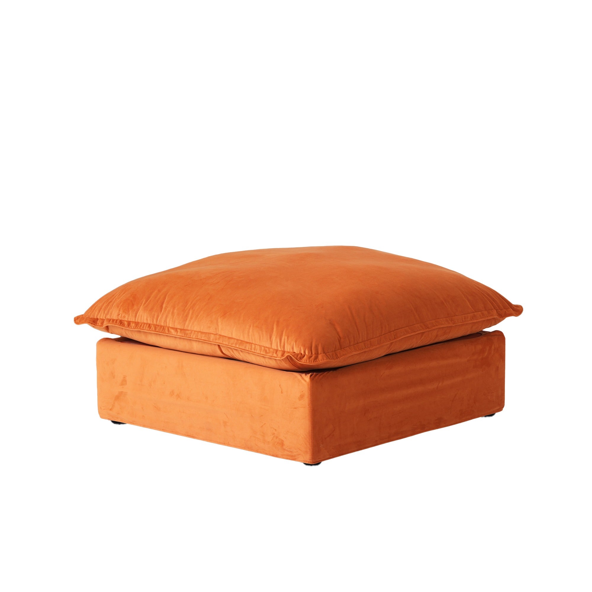 Orange velvet ottoman with washable covers on a white background