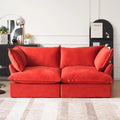 Red velvet 2-seater sofa with flared arms and washable covers.