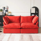 Red velvet 2-seater sofa with flared arms and washable covers.