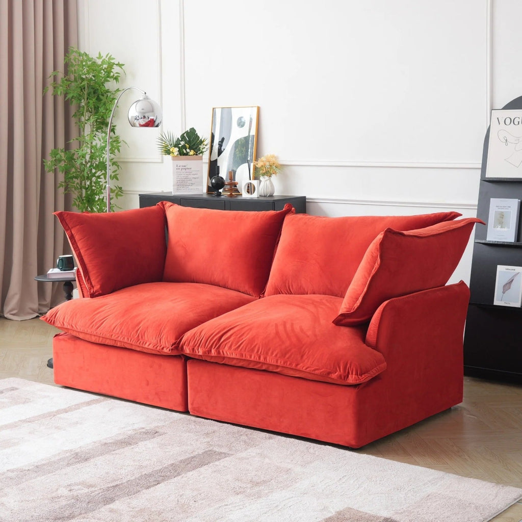 Washable 2-seater sofa with flared arms and washable covers, side view.