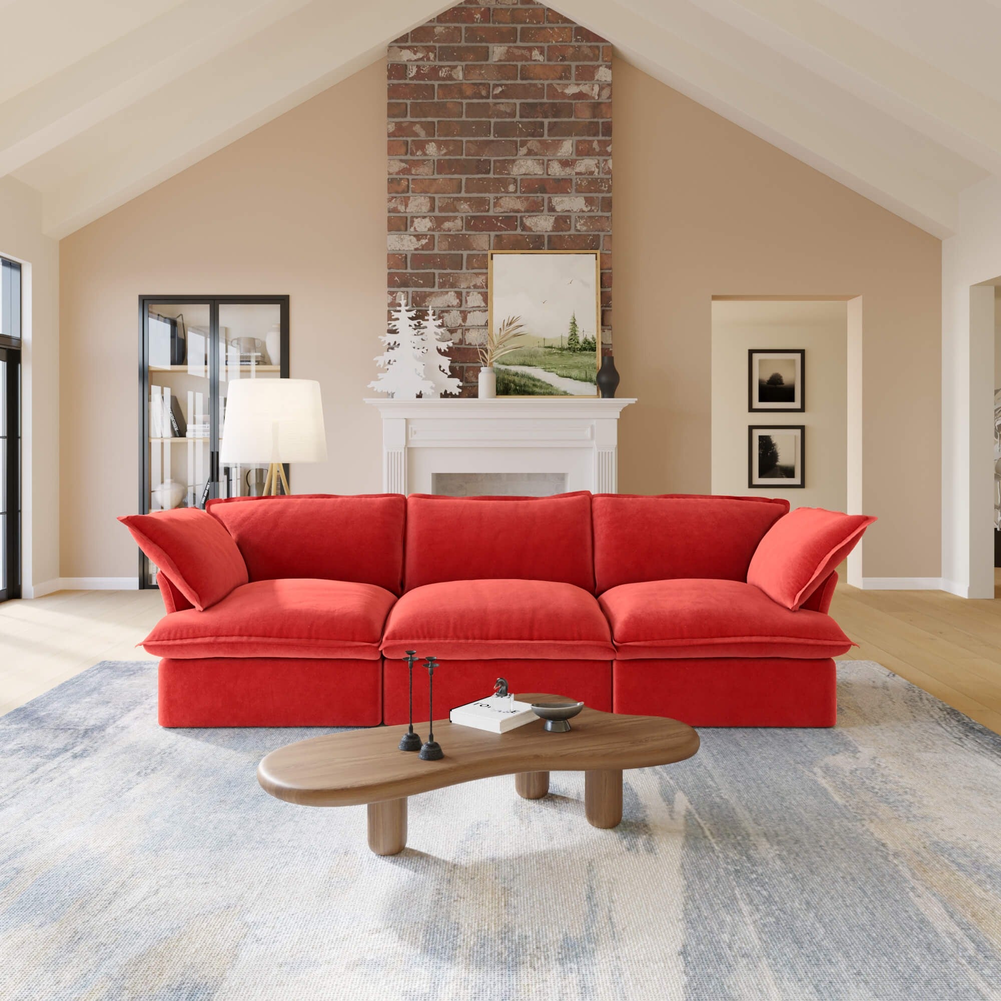Red 3-seat sofa in a living room with a coffee table and decorative items.