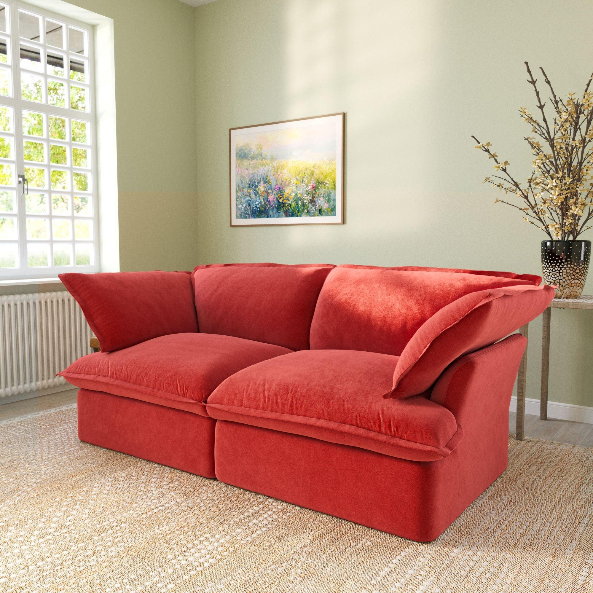 Modular velvet loveseat sofa with curved armrests in red, side