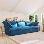 Sky blue 3-seat sofa in a living room with wooden floor and white walls