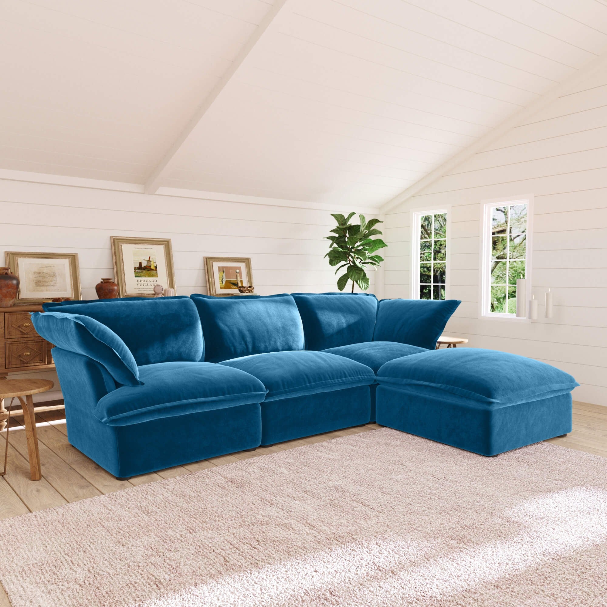 Sky blue L-shaped 4-seater sectional sofa in a living room with white walls and wooden floor.