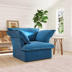 Sky blue armchair in a room with a plant and window